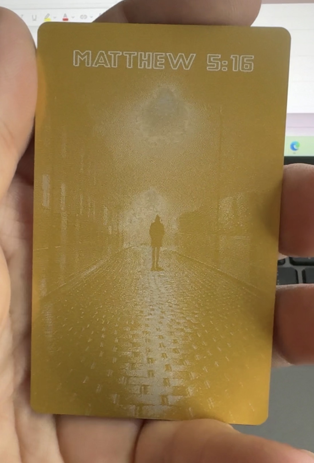 Light Post Industries Gold anodized business card — back